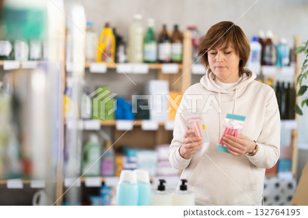 Adult woman choosing razor in store 132764195