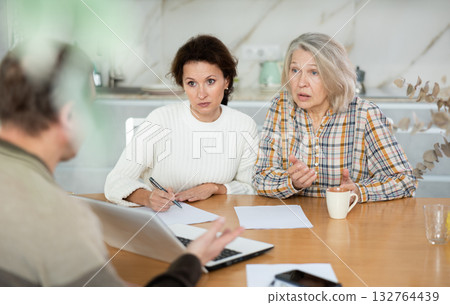 Mother and daughter considering offer from agent 132764439