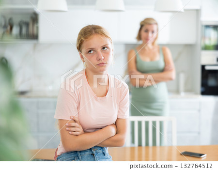 Blurry mum and girl crossed arms and standing apart from each other, ignore do not talk Blurry mum and girl crossed arms and standing apart from each other, ignore do not talk 132764512