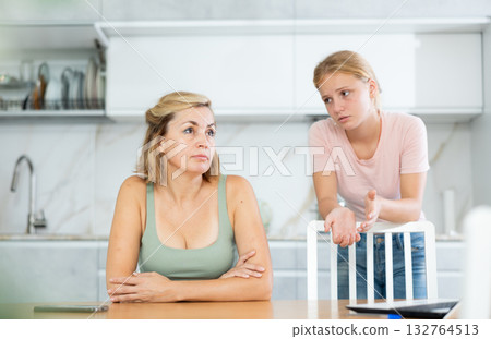 Teenage daughter asking for forgiveness from upset mother 132764513
