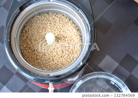 Brown rice placed in a home rice polisher 132764569