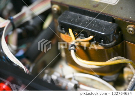 Close-up of the internal circuit board and electronic components of an audio amplifier 132764684