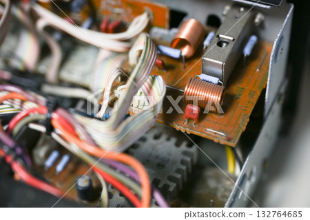 Close-up of the internal circuit board and electronic components of an audio amplifier 132764685