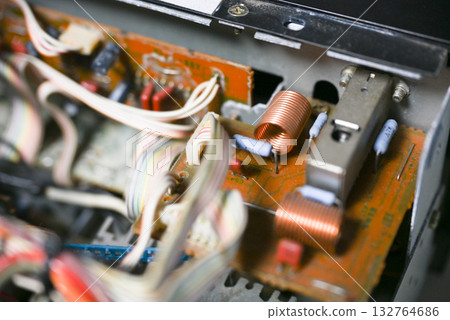 Close-up of the internal circuit board and electronic components of an audio amplifier 132764686