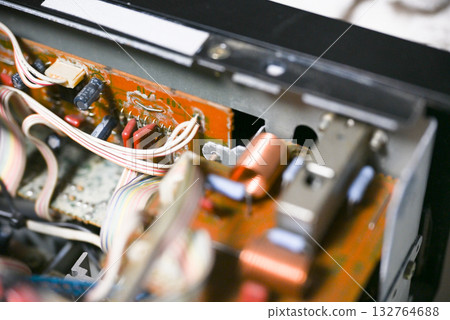 Close-up of the internal circuit board and electronic components of an audio amplifier 132764688