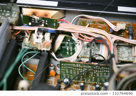 Close-up of the internal circuit board and electronic components of an audio amplifier 132764690