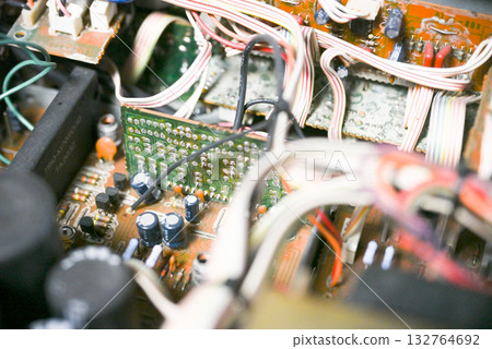 Close-up of the internal circuit board and electronic components of an audio amplifier 132764692