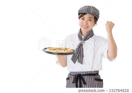 A young Asian woman in a chef's coat holding a pizza A young Asian woman in a chef's coat holding a pizza 132764828