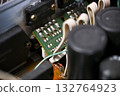 Close-up of the internal circuit board and electronic components of an audio amplifier 132764923