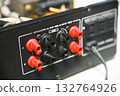 Close-up of the internal circuit board and electronic components of an audio amplifier 132764926