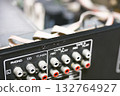Close-up of the internal circuit board and electronic components of an audio amplifier 132764927