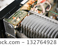 Close-up of the internal circuit board and electronic components of an audio amplifier 132764928