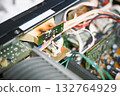 Close-up of the internal circuit board and electronic components of an audio amplifier 132764929