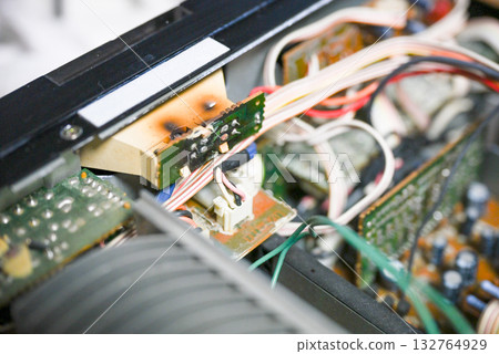 Close-up of the internal circuit board and electronic components of an audio amplifier 132764929