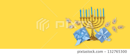 Decorative menorah with blue candles and gifts near dreidels Decorative menorah with blue candles and gifts near dreidels 132765300