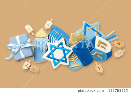 Decorative Hanukkah cookies and dreidels with gifts displayed Decorative Hanukkah cookies and dreidels with gifts displayed 132765315