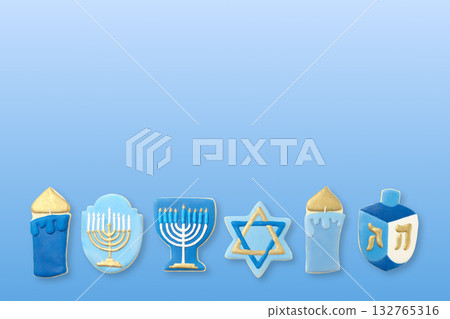 Hanukkah, blue and gold cookies shaped like menorahs and dreidels 132765316