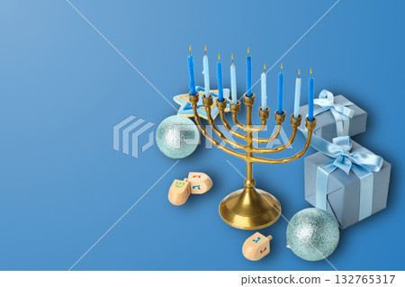 Blue-background menorah with candles, dreidels, and gifts Blue-background menorah with candles, dreidels, and gifts 132765317
