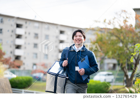 Man making a delivery Man making a delivery 132765429