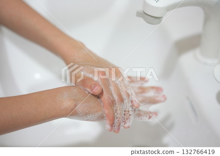 Children's hands washing hands with soap Children's hands washing hands with soap 132766419