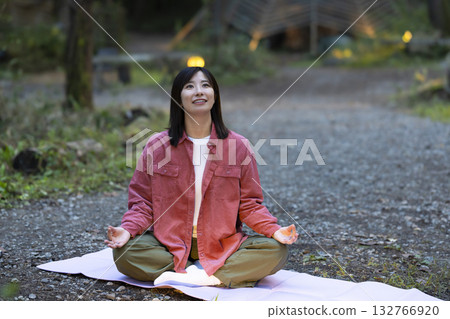 Woman meditating in nature Woman meditating in nature 132766920