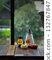 Halloween figure with small pumpkins on wood table 132767847