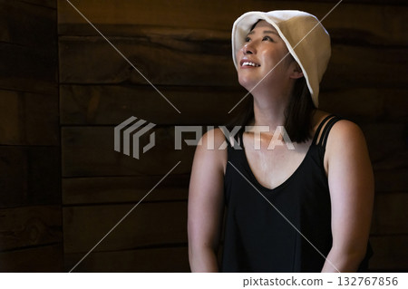Woman enjoying the sauna Woman enjoying the sauna 132767856