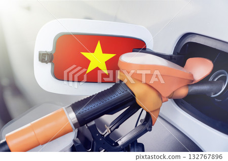 Vietnam flag on the lid of the gas tank of a car at a gas station in close-up. High or low prices for gasoline and diesel fuel at Vietnamese gas stations. shortage of fuel for cars in Vietnam. Vietnam flag on the lid of the gas tank of a car at a gas station in close-up. High or low prices for gasoline and diesel fuel at Vietnamese gas stations. shortage of fuel for cars in Vietnam. 132767896