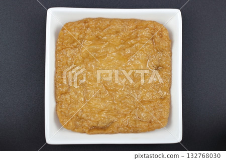 Fried tofu, a staple on Japanese dining tables, served in a white dish 132768030