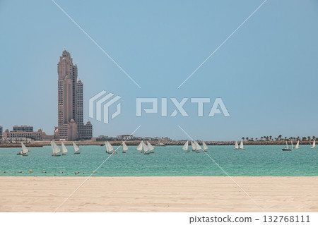 View of Abu Dhabi city Corniche beach and Al Marina with Rixos Marina Resort on the background View of Abu Dhabi city Corniche beach and Al Marina with Rixos Marina Resort on the background 132768111