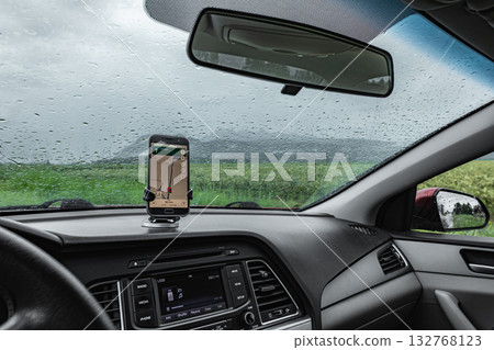 Universal mount holder with smart phone on windshield of automobile for GPS. Universal mount holder with smart phone on windshield of automobile for GPS. 132768123