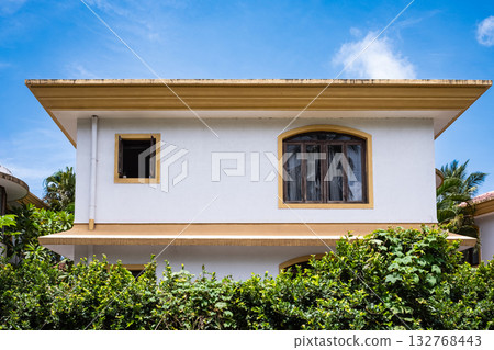 Front facade modern villa house with windows in tropical rainforest greenery landscape. 132768443