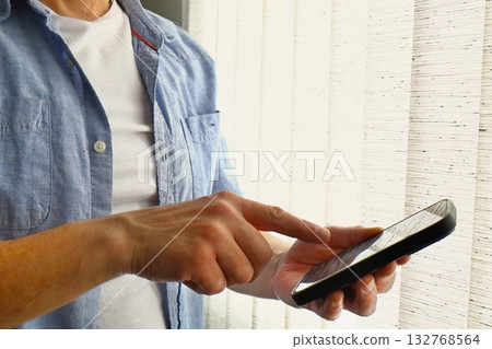 Man using smartphone close up 132768564