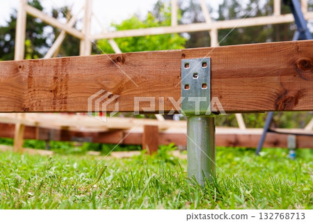 Deck Foundation Construction with Ground Screw and Wood Frame Support System. 132768713