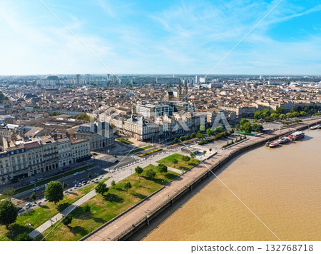 Bordeaux, France Aerial View of Cityscape, Garonne River, and Quayside Promenade. Drone Shot Bordeaux, France Aerial View of Cityscape, Garonne River, and Quayside Promenade. Drone Shot 132768718