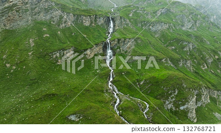 Majestic Mountain Waterfall Scenery, Lush Greenery, and Stunning Natural Beauty Above the Clouds Majestic Mountain Waterfall Scenery, Lush Greenery, and Stunning Natural Beauty Above the Clouds 132768721