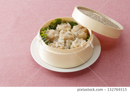 Steamed meat shumai in a bamboo steamer with a lid 132769315