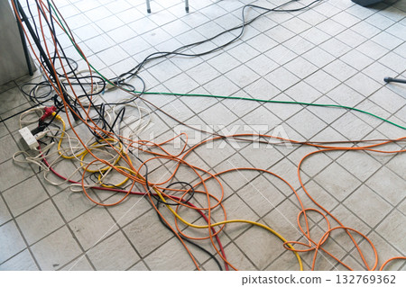 Electrical wiring and sound cables spread across the floor 132769362