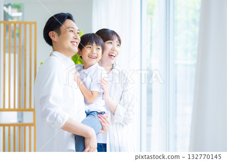 Family looking out the window Family looking out the window 132770145
