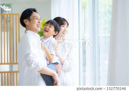 Family looking out the window Family looking out the window 132770146