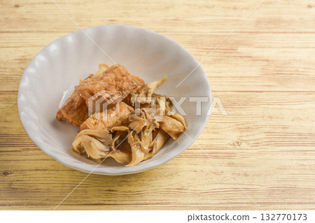 Maitake mushroom and deep-fried tofu stew Maitake mushroom and deep-fried tofu stew 132770173
