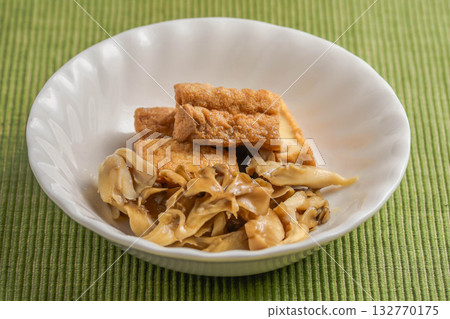 Maitake mushroom and deep-fried tofu stew Maitake mushroom and deep-fried tofu stew 132770175