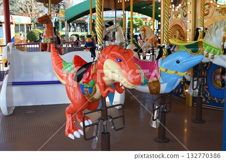A local amusement park that's popular with children, filled with colorful rides A local amusement park that's popular with children, filled with colorful rides 132770386