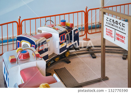 A local amusement park that's popular with children, filled with colorful rides 132770390