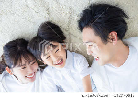 Family image: Family lying on the floor Family image: Family lying on the floor 132770615