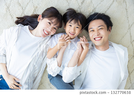 Family image: Family lying on the floor Family image: Family lying on the floor 132770638