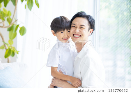 Family: Father and son relaxing Family: Father and son relaxing 132770652