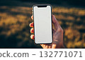High-resolution mockup of a smartphone screen held in a hand 132771071