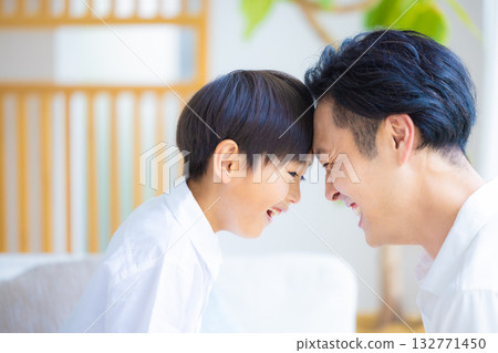 Family: Father and son relaxing Family: Father and son relaxing 132771450