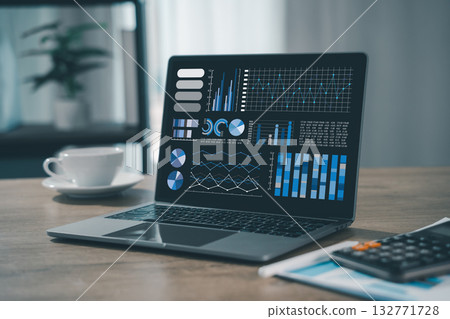 business analyst used a laptop to analyze financial statistics, creating a digital dashboard for marketing performance reports. business analyst used a laptop to analyze financial statistics, creating a digital dashboard for marketing performance reports. 132771728